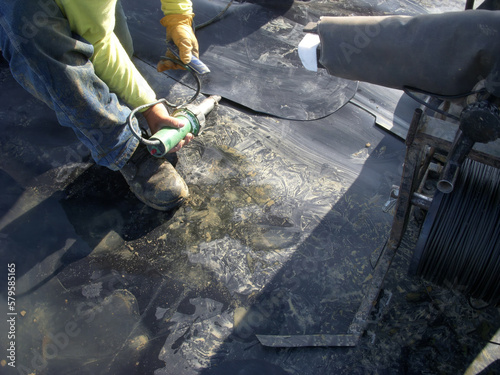 Принти на полотні HDPE landfill liner patch being prepped for installation to repair a bad weld