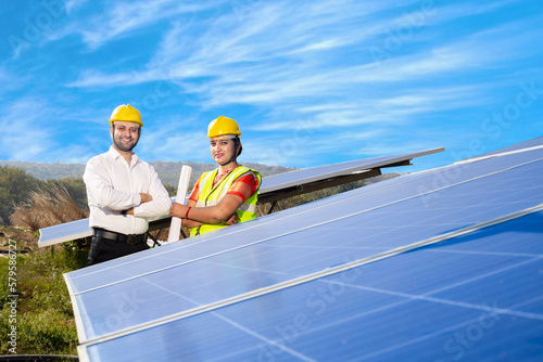 Wallpaper Mural Indian Engineer standing with solar panel installation. Concept of renewable and clean energy. India.  Torontodigital.ca