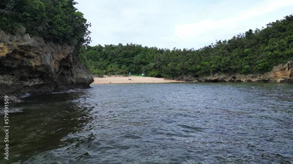 Aerial, Rising shot of secret white sand beach resort with stunning clear waters and palm trees in Catanduanes, Philippines. Aerial, Rising shot of secret white sand beach resort with stunning clear waters and palm trees in Catanduanes, Philippines.