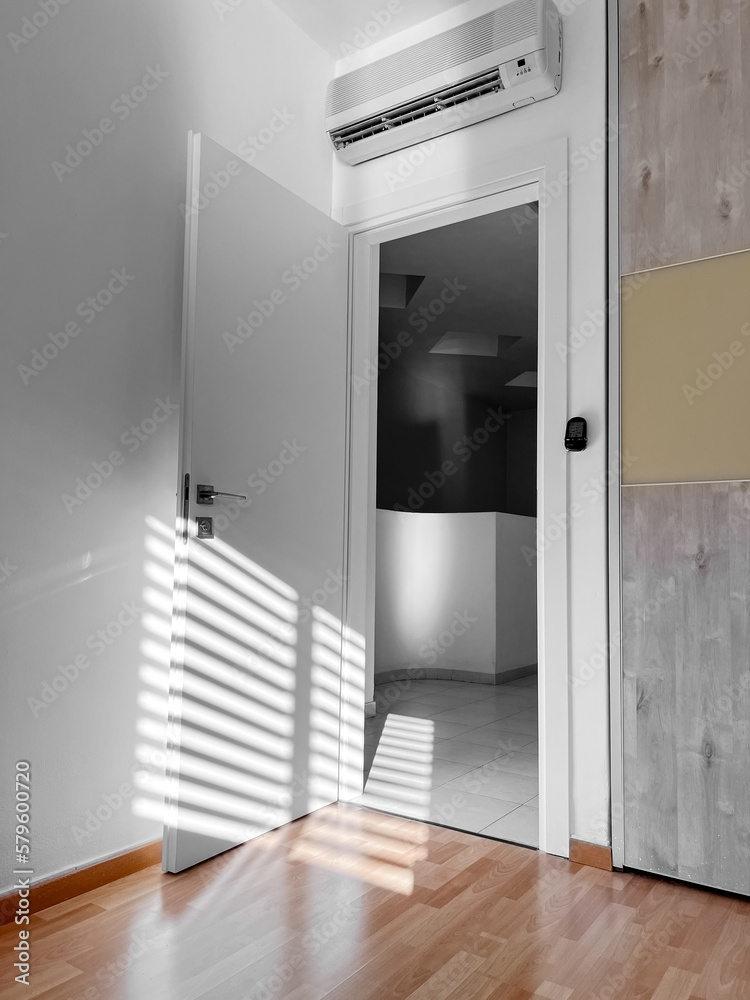 Open white door in light room Open white door in light room