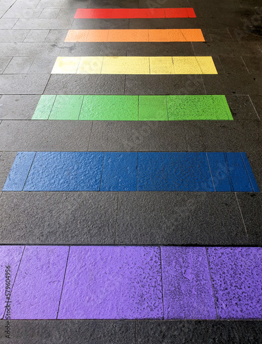 pedestrian crossing painted with rainbow stripes on street celebrating LGBTQI+ rights & inclusiveness