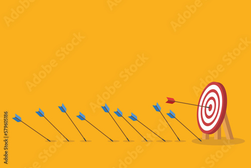Business challenge failure and success concept. Blue arrows missed hitting target and only red one hits the center.