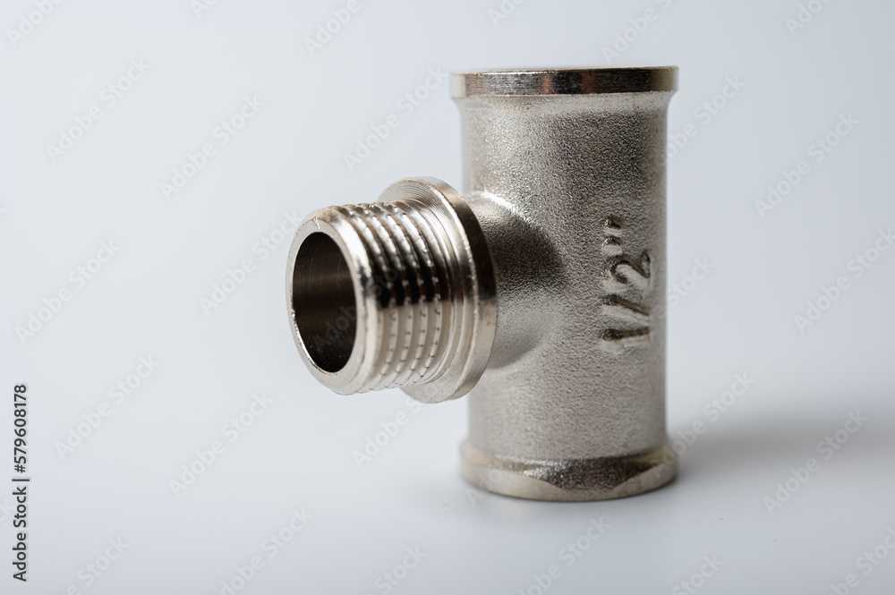 brass metal tee water adapters isolated on light background close up plumbing connections and details brass metal tee water adapters isolated on light background close up plumbing connections and details