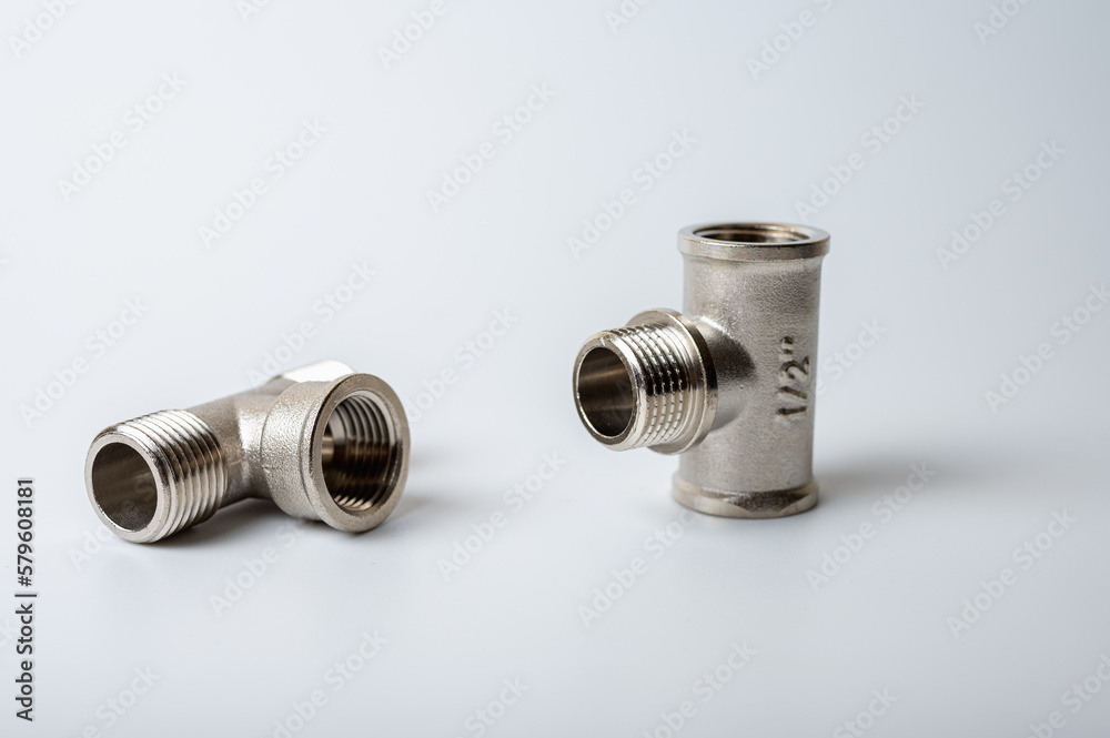 brass metal tee water adapters isolated on light background close up plumbing connections and details brass metal tee water adapters isolated on light background close up plumbing connections and details