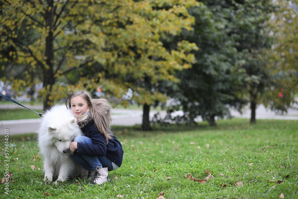 Lovely girl on a walk with a beautiful dog Lovely girl on a walk with a beautiful dog