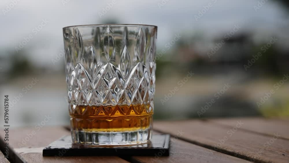 Pouring whiskey into glass footage