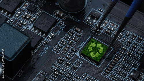 Green technology concept, recycling sign on circuit board technology innovation and IT ethics. Earth's green nature or new system technology