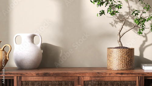 Asian antique vintage wooden cabinet top with tropical tree in rattan basket, clay vase in sunlight, shadow on blank beige wall for interior design decoration, beauty, fashion product background 3D