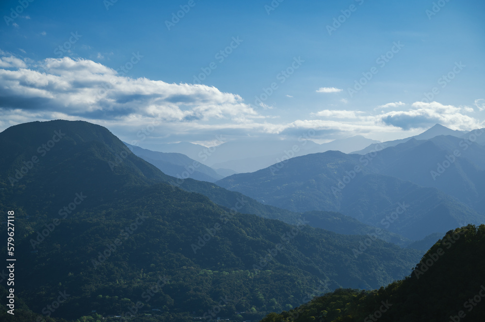 White clouds and blue sky above the green mountain. It's refreshing to the mind. Pay attention to climate change and industrial development. Taiwan White clouds and blue sky above the green mountain. It's refreshing to the mind. Pay attention to climate change and industrial development. Taiwan