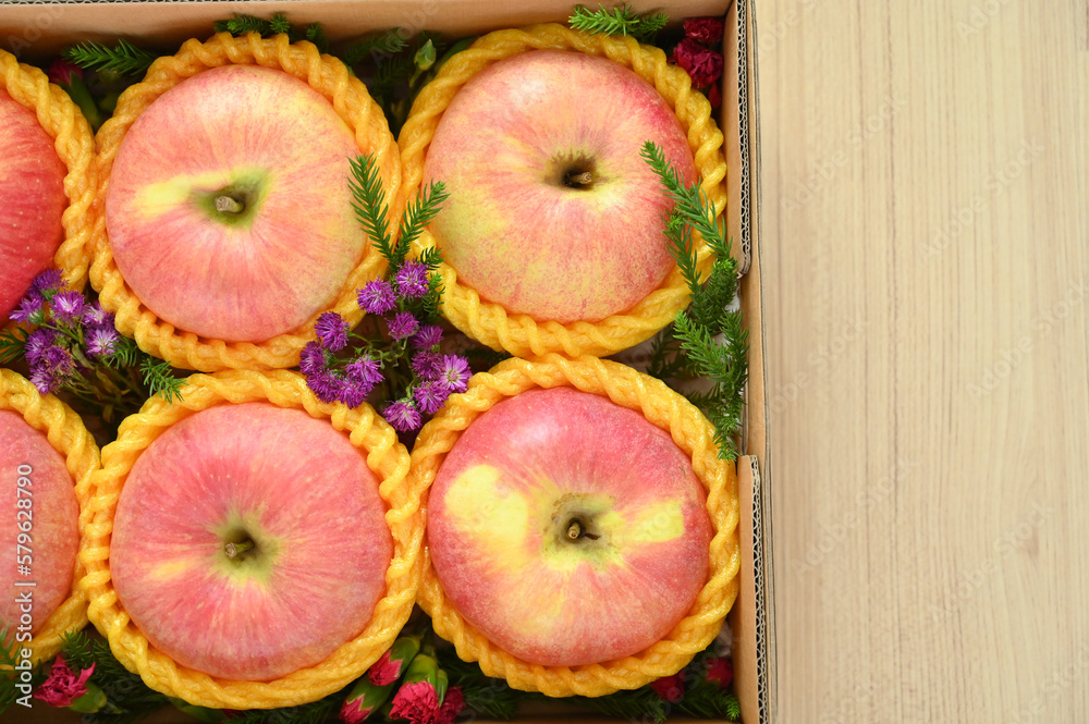 beautiful pink apple in the box on wood floor, healthy fruit beautiful pink apple in the box on wood floor, healthy fruit