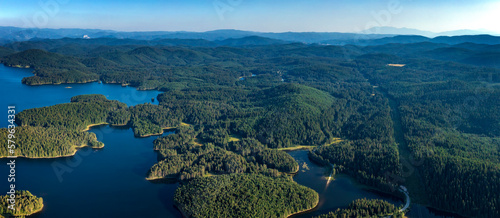 Aerial panorama from drone of blue water and green forest. photo