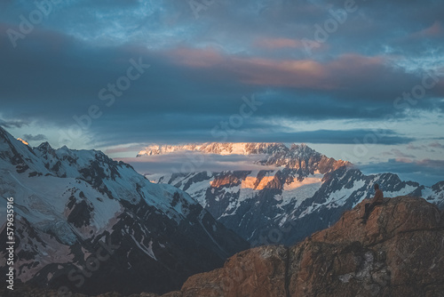 Hiker watching sunrise at Mt Cook, New Zealand