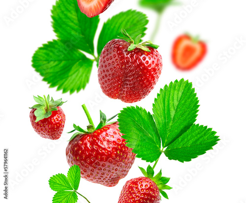 Ripe fresh flying red strawberry, green leaves isolated on white background. With clipping path. Strawberry cut out pattern. Summer delicious sweet berry organic fruit food diet vitamins. Mockup