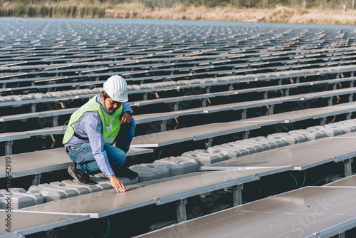 Male engineer installing or checking the working condition of solar panels on the roof or at the height of the factory for saving electricity was broken to use renewable energy from the sun © Chocheng channel