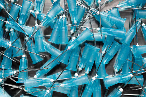 High angle view of syringe needles on table photo