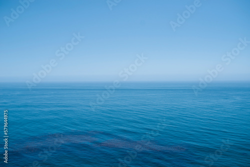 Scenic view of sea against blue sky during summer photo