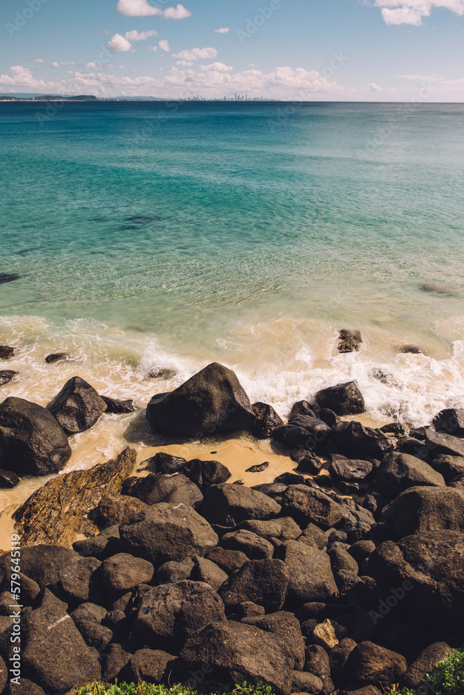 Scenic view of beach against sky during sunny day Scenic view of beach against sky during sunny day