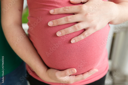 Wallpaper Mural Midsection of pregnant woman touching belly while standing in porch Torontodigital.ca