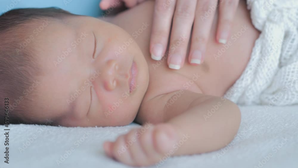 Mother cares for baby, comforting, and support, a newborn at home Mother cares for baby, comforting, and support, a newborn at home