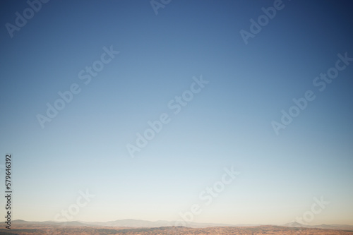 Tranquil view of landscape against clear blue sky