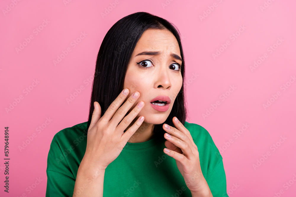 Photo of horrified pretty adorable girl with bob hairdo dressed green t-shirt touching cheek skin care isolated on pink color background Photo of horrified pretty adorable girl with bob hairdo dressed green t-shirt touching cheek skin care isolated on pink color background