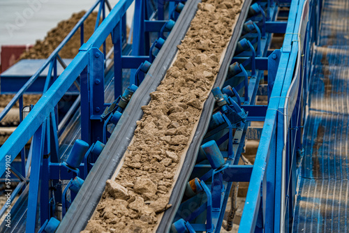 Industrial belt conveyor moving raw materials from mine
