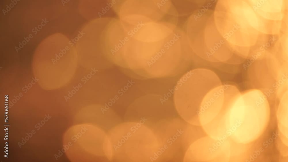 Blurred golden sea at sunset. The sun reflects and sparkles on the waves with bokeh, illuminating the golden sea. Holiday recreation concept. Abstract nautical summer ocean sunset nature background Blurred golden sea at sunset. The sun reflects and sparkles on the waves with bokeh, illuminating the golden sea. Holiday recreation concept. Abstract nautical summer ocean sunset nature background
