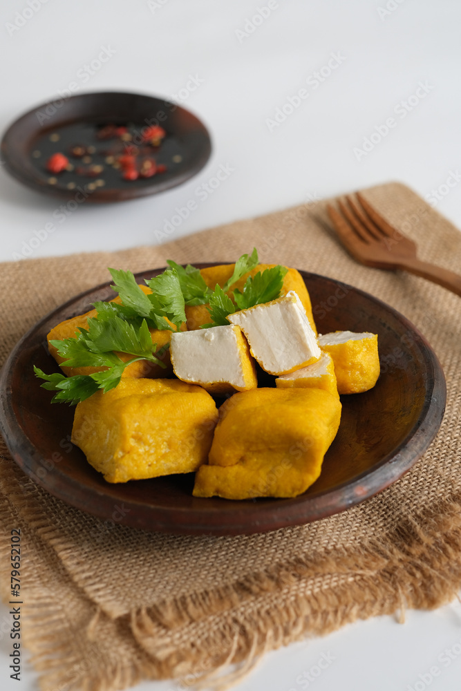 fried yellow tofu in plate