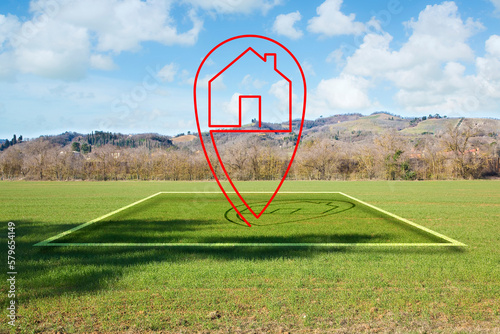 Land plot management - real estate concept with a vacant land parcel available for building construction - housing concept with a red house icon photo