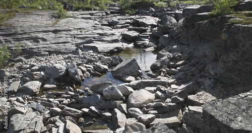 Rocky river bed in summer, Skibotndalen, Norway. photo