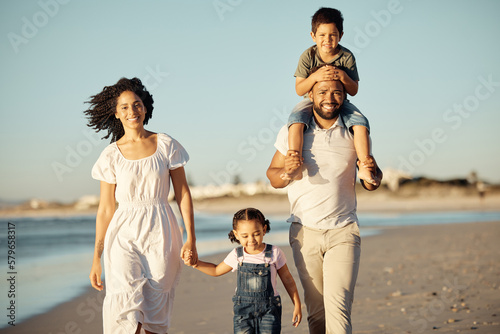 Happy, beach and walking with family at sunset on holiday for love, summer and travel together. Smile, nature and sunshine with portrait of parents and children on Miami Florida vacation by the sea