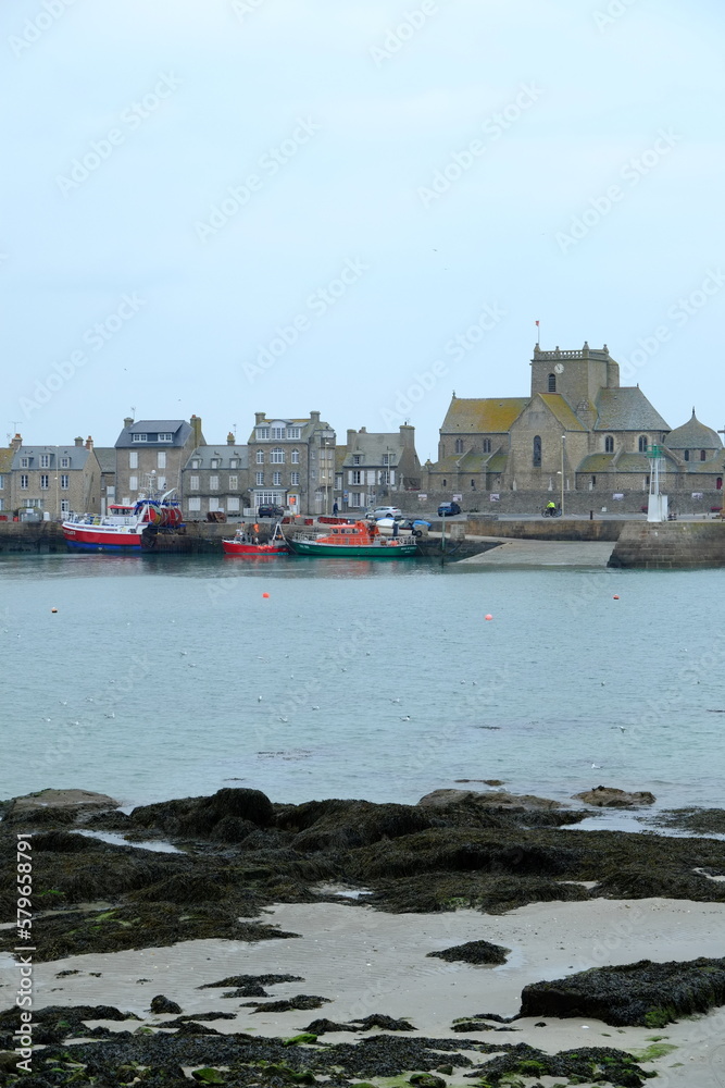 Barfleur, France - March 5th, 2023: A view of the harbor of Barfleur on a cloudy day.