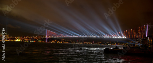 Istanbul Bosphorus Bridge and panoramic night view shot. Republic celebrations.. Bosphorus bridge Laser light show.