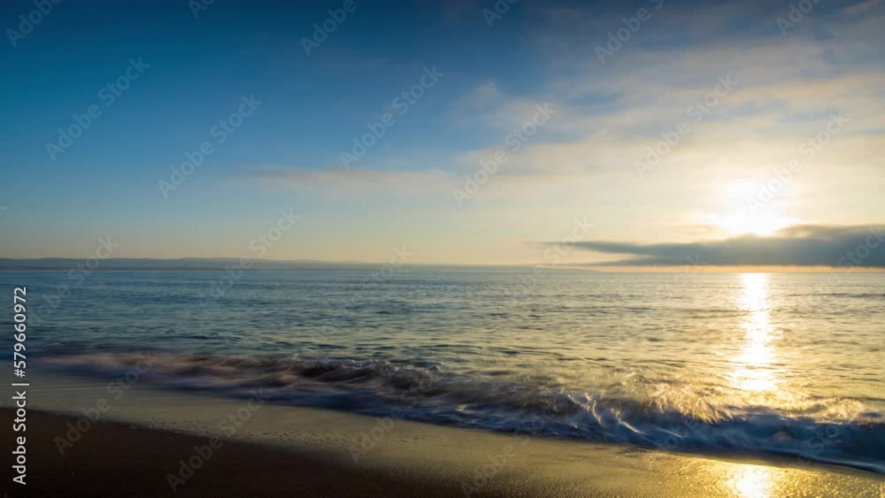 Black Sea and beach nearby against a sky with clouds and a dawn sun Black Sea and beach nearby against a sky with clouds and a dawn sun