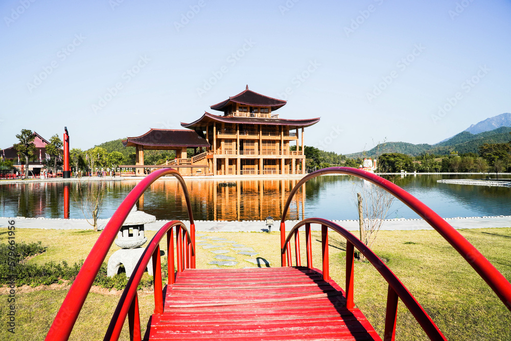 Hinoki Land building (Bann Mai Hom Hinoki) with red torii gate in Chiang Mai Thailand. Japanses building style beside the lake. New tourist attraction in Chiang Mai, Thailand. Hinoki Land building (Bann Mai Hom Hinoki) with red torii gate in Chiang Mai Thailand. Japanses building style beside the lake. New tourist attraction in Chiang Mai, Thailand.