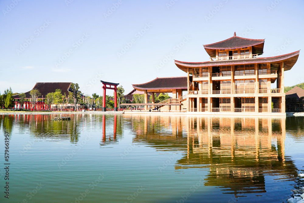 Hinoki Land building (Bann Mai Hom Hinoki) with red torii gate in Chiang Mai Thailand. Japanses building style beside the lake. New tourist attraction in Chiang Mai, Thailand. Hinoki Land building (Bann Mai Hom Hinoki) with red torii gate in Chiang Mai Thailand. Japanses building style beside the lake. New tourist attraction in Chiang Mai, Thailand.