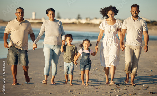 Family beach, holiday walking and children holding hands on vacation in Australia, happy with grandparents and parents by sea and travel time together. Portrait of elderly people in nature with kids