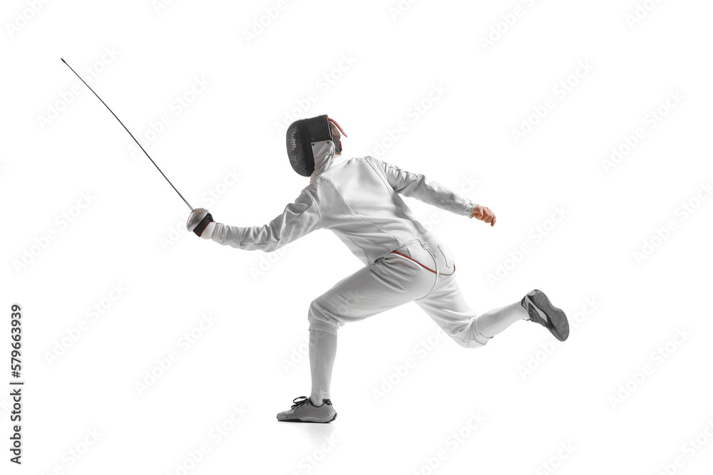 Dynamic portrait of male athlete in fencing costume with sword in hand in action isolated on white studio background. Dynamic portrait of male athlete in fencing costume with sword in hand in action isolated on white studio background.