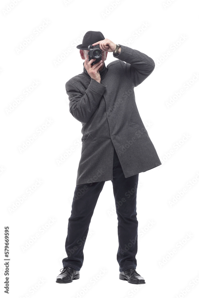 in full growth. Mature intelligent man with a camera. in full growth. Mature intelligent man with a camera.