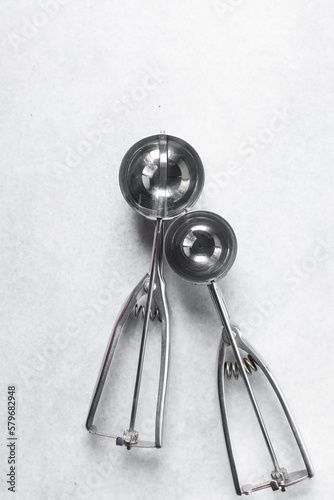 Silver cookie scoops on a white background, Top view of cookie scoops used for ice cream or cookie dough