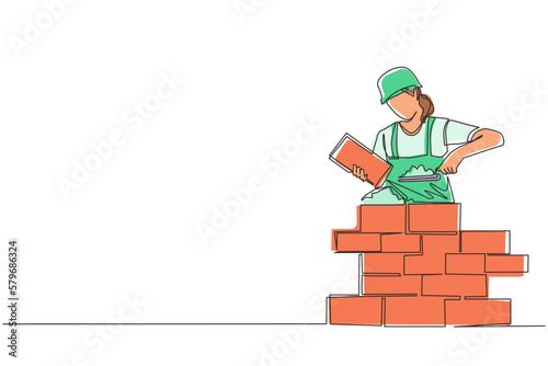 Continuous one line drawing repairwoman building brick wall. Construction worker in uniform and helmet doing work. Builder concept. Repair work services. Single line draw design vector illustration