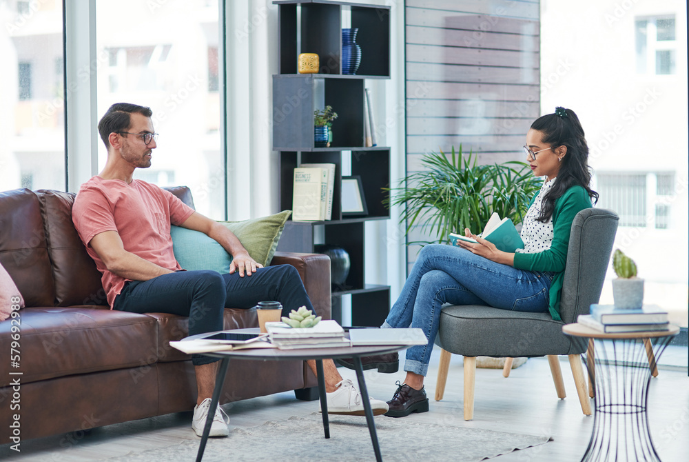 The more we talk, the more we understand. Shot of a young man and woman having a discussion in a modern office.