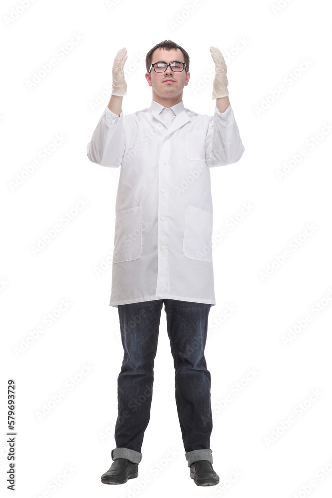 Cheerful male doctor in a white coat in gloves shows thumb up