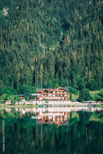 house in the mountains at a lake