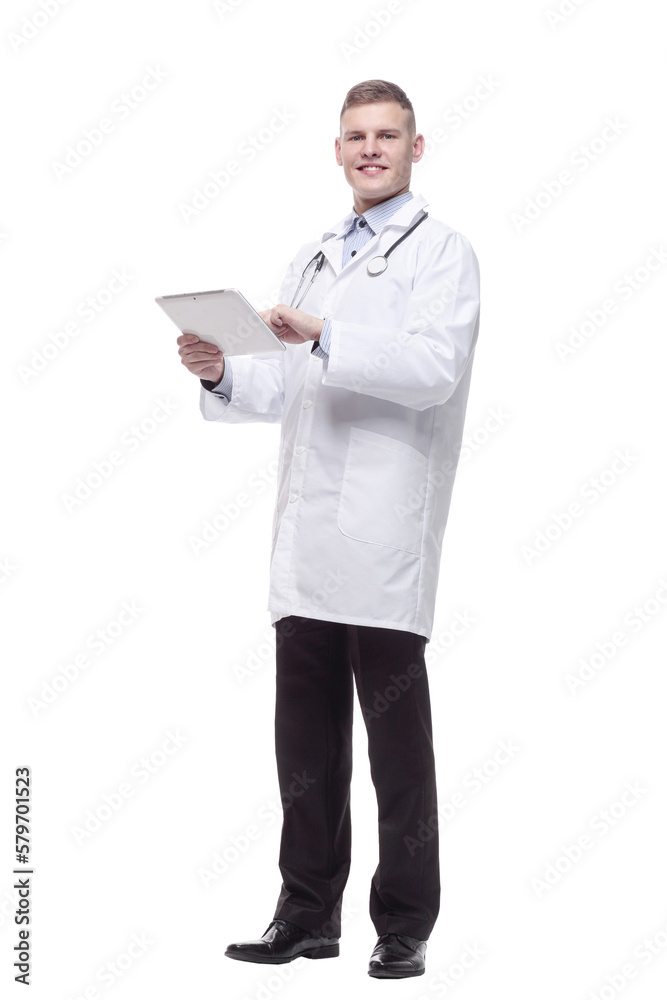 in full growth. young doctor with a digital tablet. in full growth. young doctor with a digital tablet.