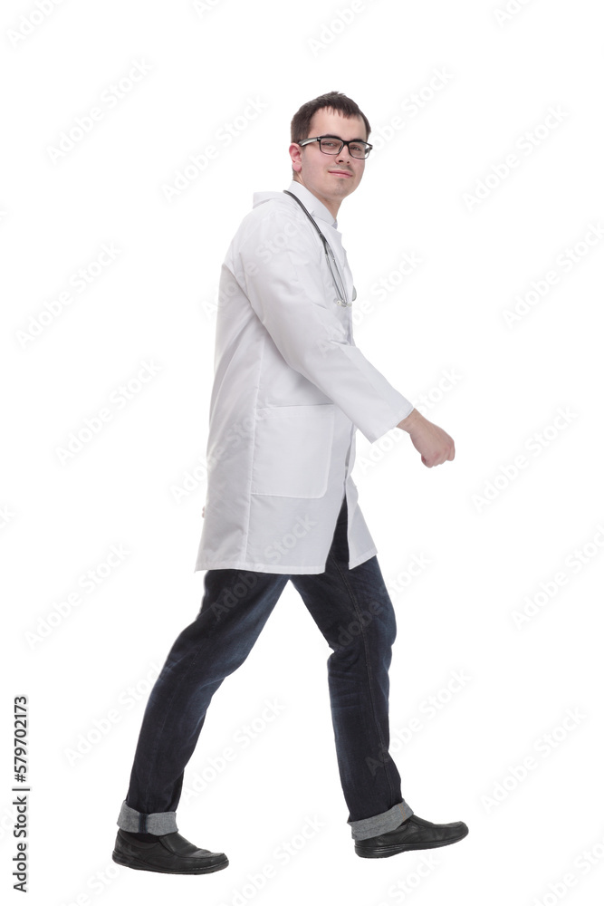 Male doctor walking isolated over a white background -side view Male doctor walking isolated over a white background -side view
