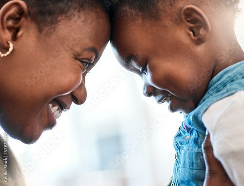 Mommas little sugar plum. Shot of an adorable little girl spending quality time with her mother at home. photo