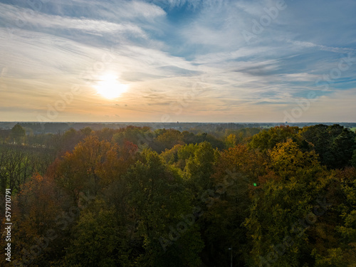 aerial view of beautiful sunrise over forest in Belgium during autumn. High quality photo