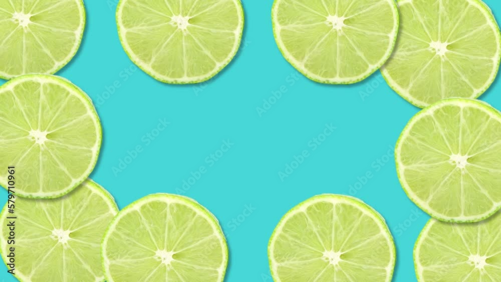 Sliced lime fruit on blue background with stop motion effect. Seamless loop video