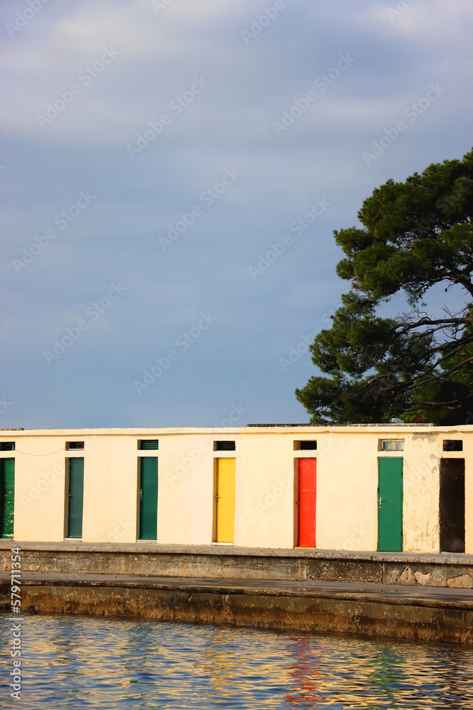 Colorful changing cabins, landmark on beach Jadrija, in Sibenik, Croatia. Colorful changing cabins, landmark on beach Jadrija, in Sibenik, Croatia.